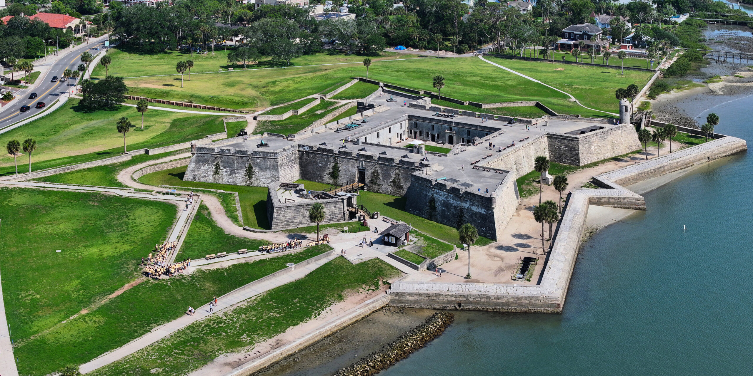 Aerial view of a historic waterfront castle